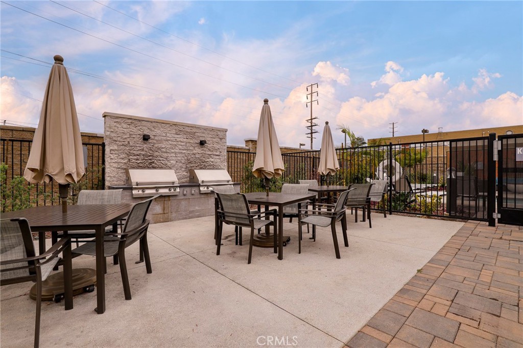 1380 Vigilant Carson, CA 90746 - Photo 33 of 43 a view of a patio with a table and chairs