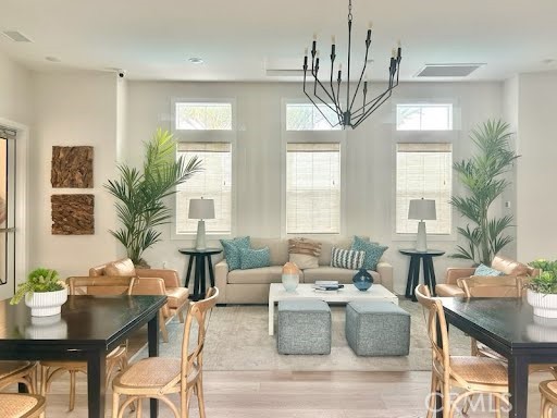 1380 Vigilant Carson, CA 90746 - Photo 37 of 43 a living room with furniture a chandelier and a chandelier