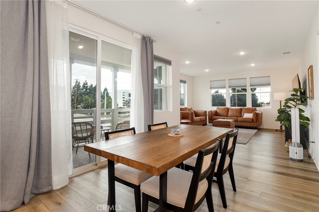 1380 Vigilant Carson, CA 90746 - Photo 8 of 43 a view of a dining room with furniture and wooden floor