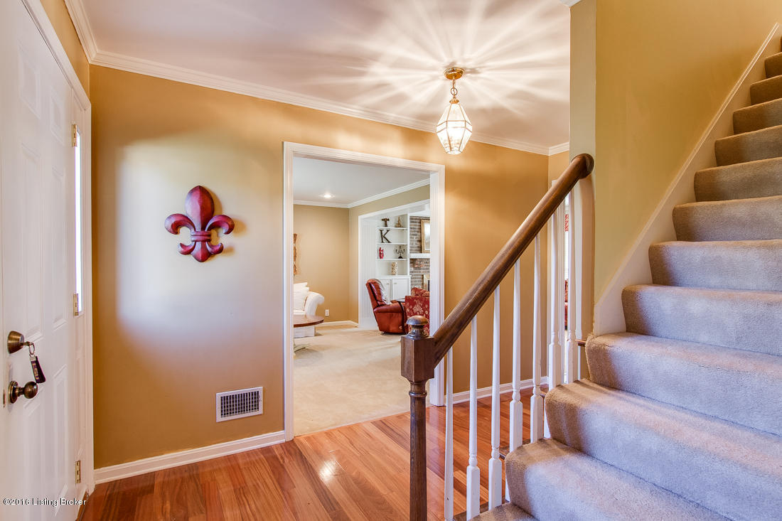 806 Moser Road Louisville, KY 40223 - Photo 3 of 34 Hardwood foyer with coat closet opens to main floor living spaces