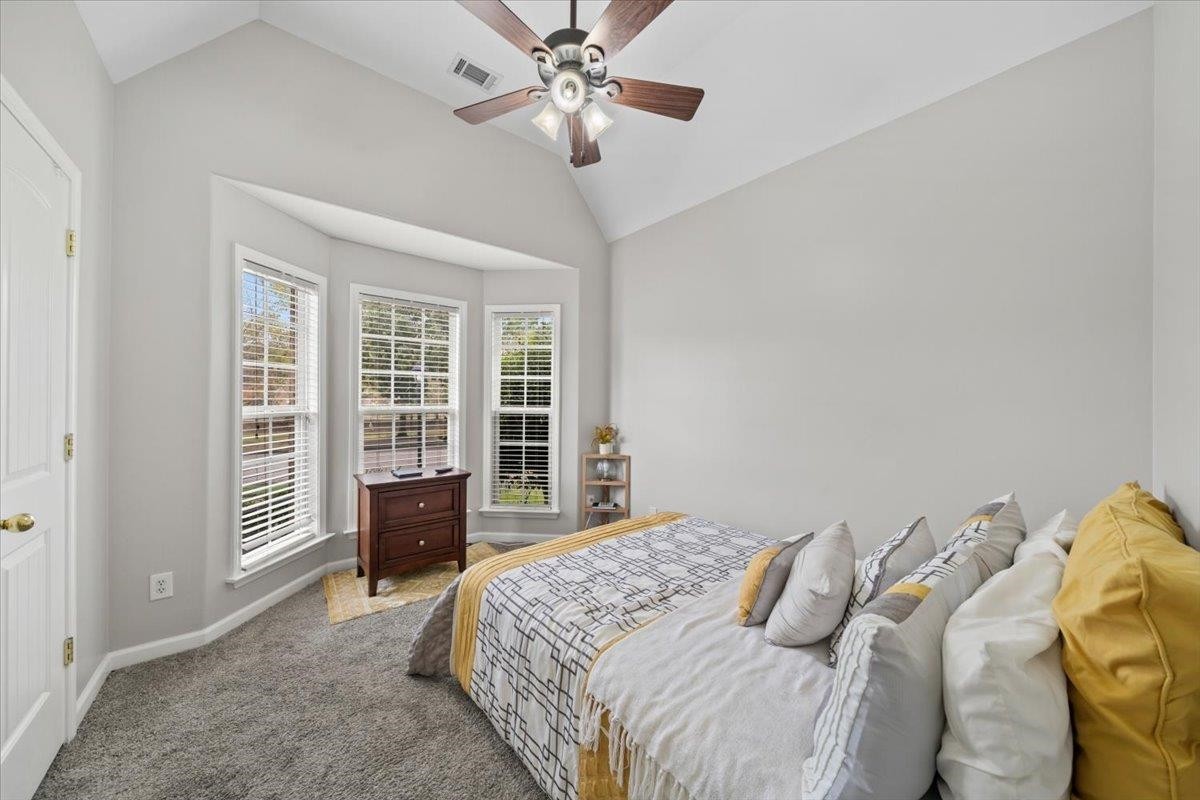 10470 Ashfarm Way Collierville, TN 38017 - Photo 11 of 15 a bedroom with a large bed and a large window
