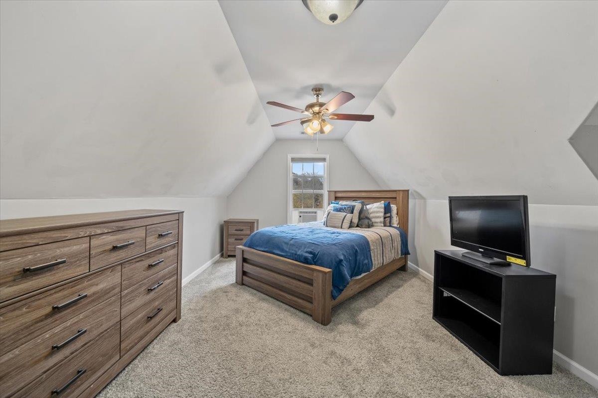 10470 Ashfarm Way Collierville, TN 38017 - Photo 13 of 15 a bedroom with a bed and a flat tv screen on dresser