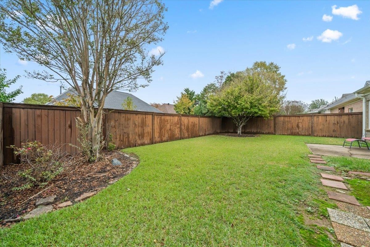 10470 Ashfarm Way Collierville, TN 38017 - Photo 14 of 15 a view of a backyard with large tree