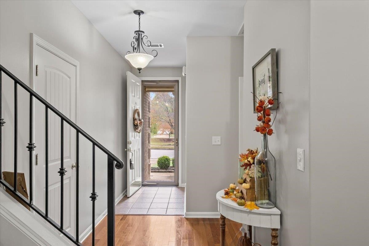 10470 Ashfarm Way Collierville, TN 38017 - Photo 2 of 15 a view of a hallway to a livingroom with furniture