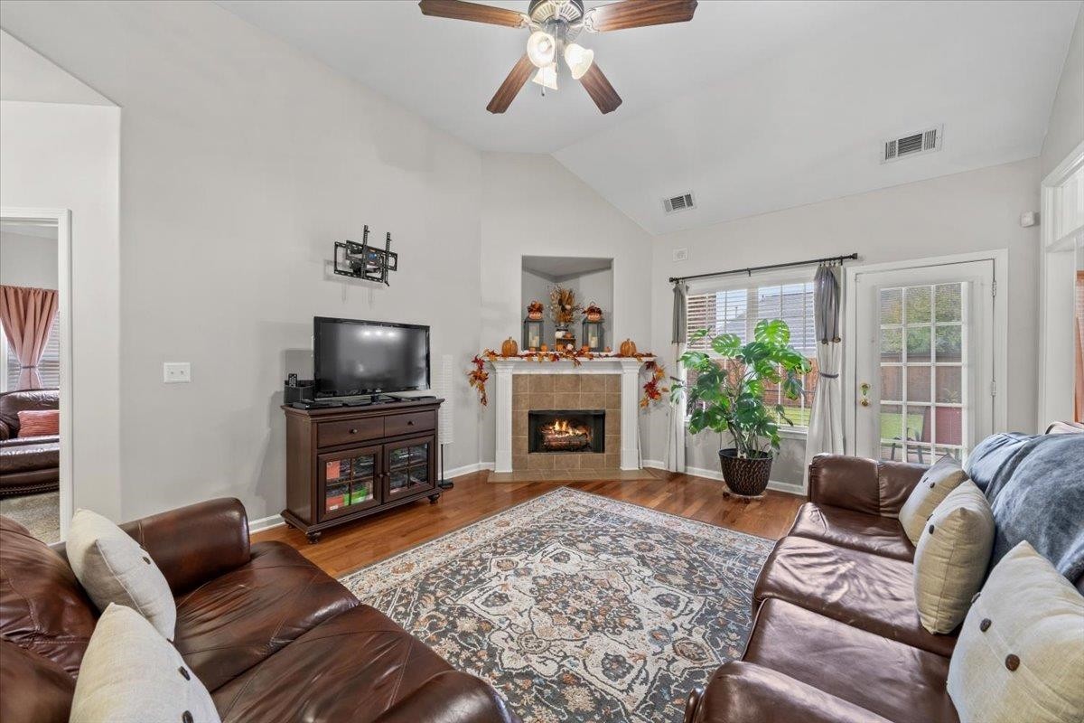 10470 Ashfarm Way Collierville, TN 38017 - Photo 4 of 15 a living room with furniture a fireplace and a flat screen tv