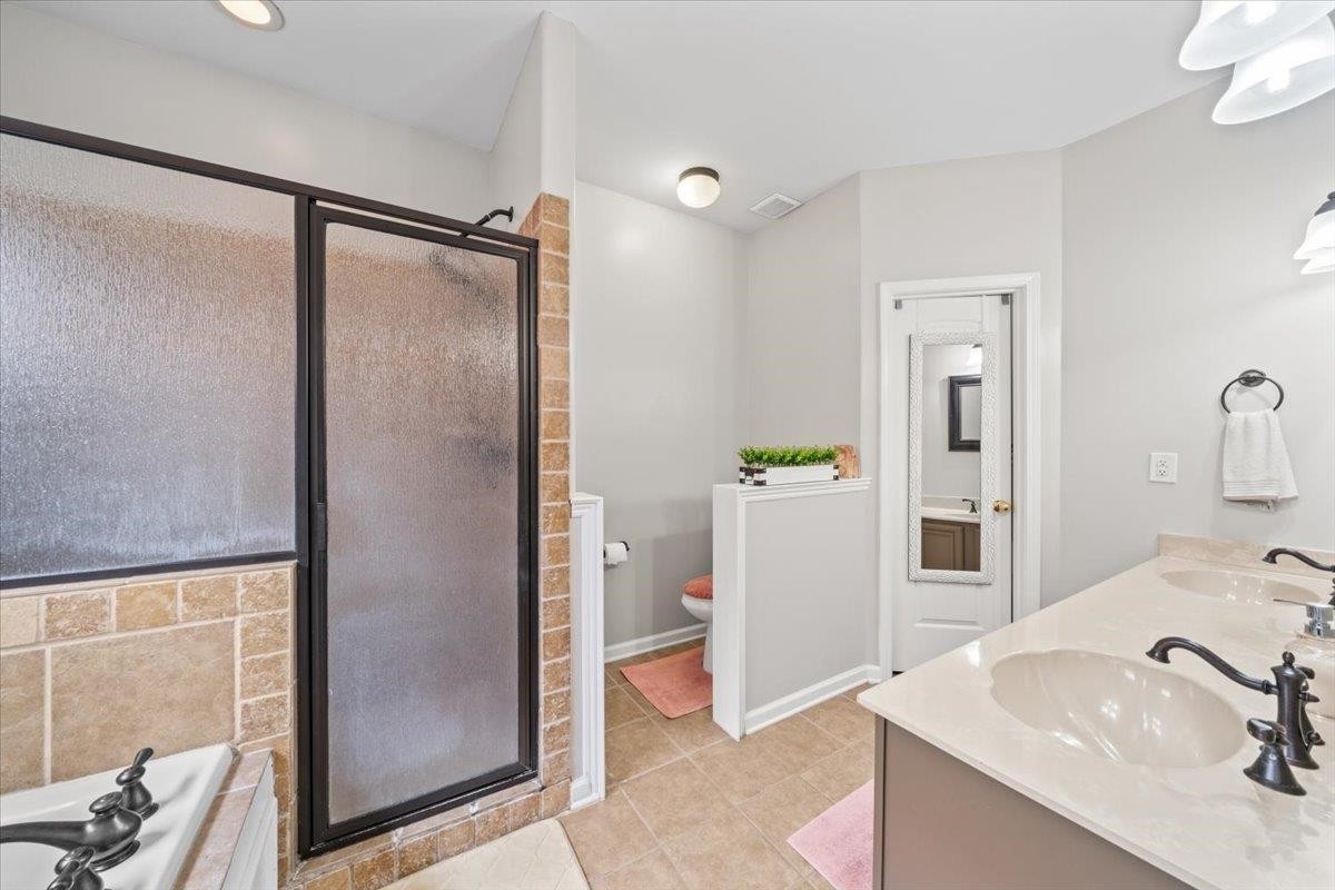 10470 Ashfarm Way Collierville, TN 38017 - Photo 9 of 15 a bathroom with a sink and mirror