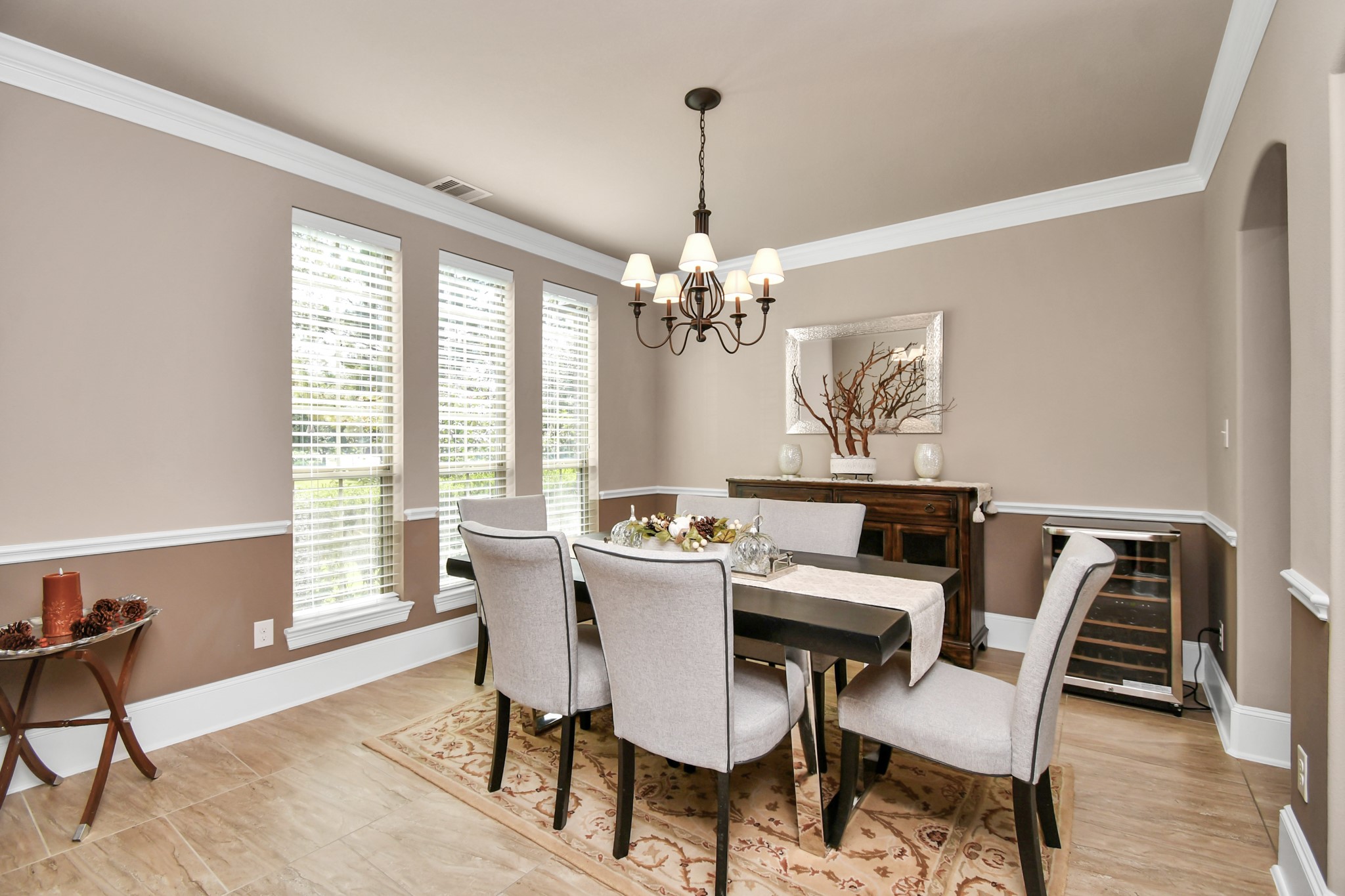 27118 Cardiff Rocks Drive Katy, TX 77494 - Photo 12 of 50 a view of a dining room with furniture a chandelier and wooden floor