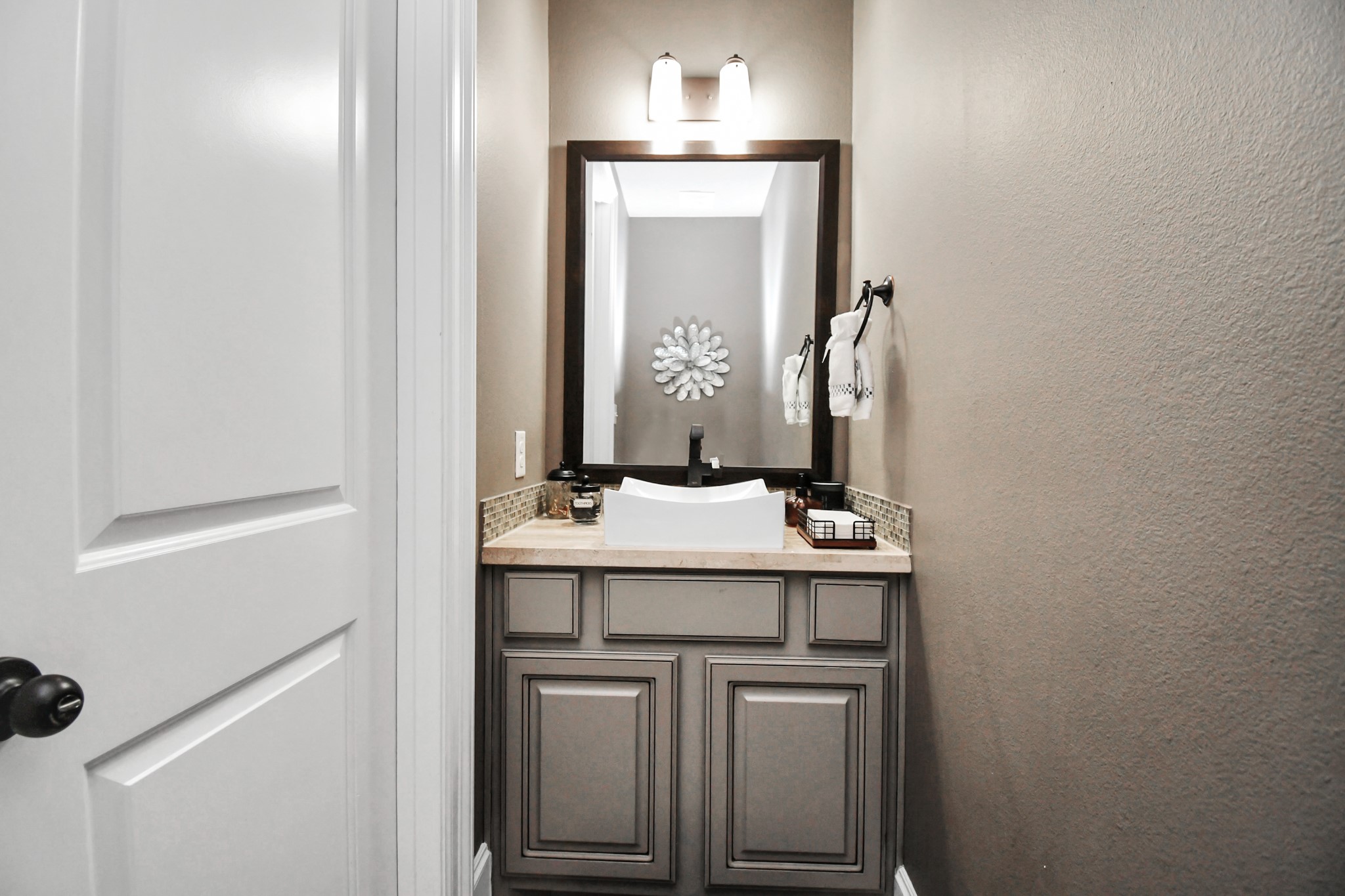 27118 Cardiff Rocks Drive Katy, TX 77494 - Photo 16 of 50 a bathroom with a sink and a mirror