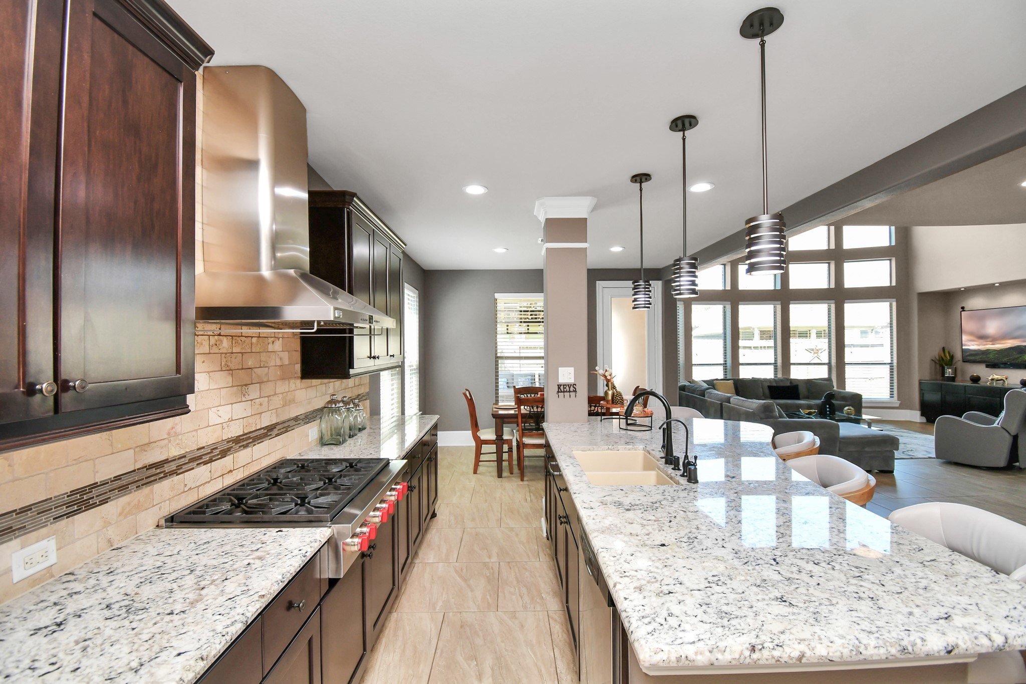 27118 Cardiff Rocks Drive Katy, TX 77494 - Photo 17 of 50 a large kitchen with kitchen island granite countertop a large counter space and stainless steel appliances