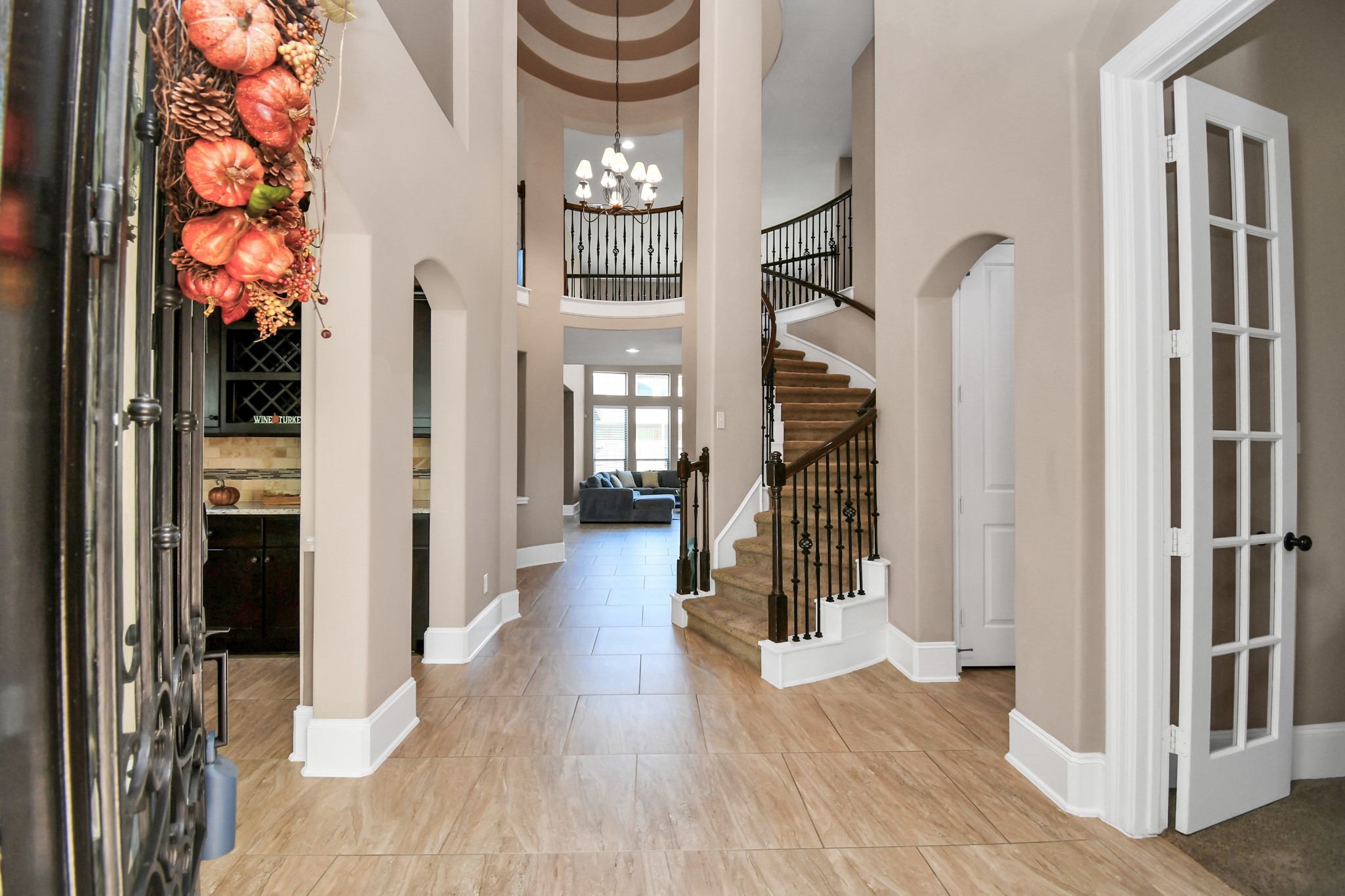 27118 Cardiff Rocks Drive Katy, TX 77494 - Photo 2 of 50 a view of a hallway with wooden floor and staircase
