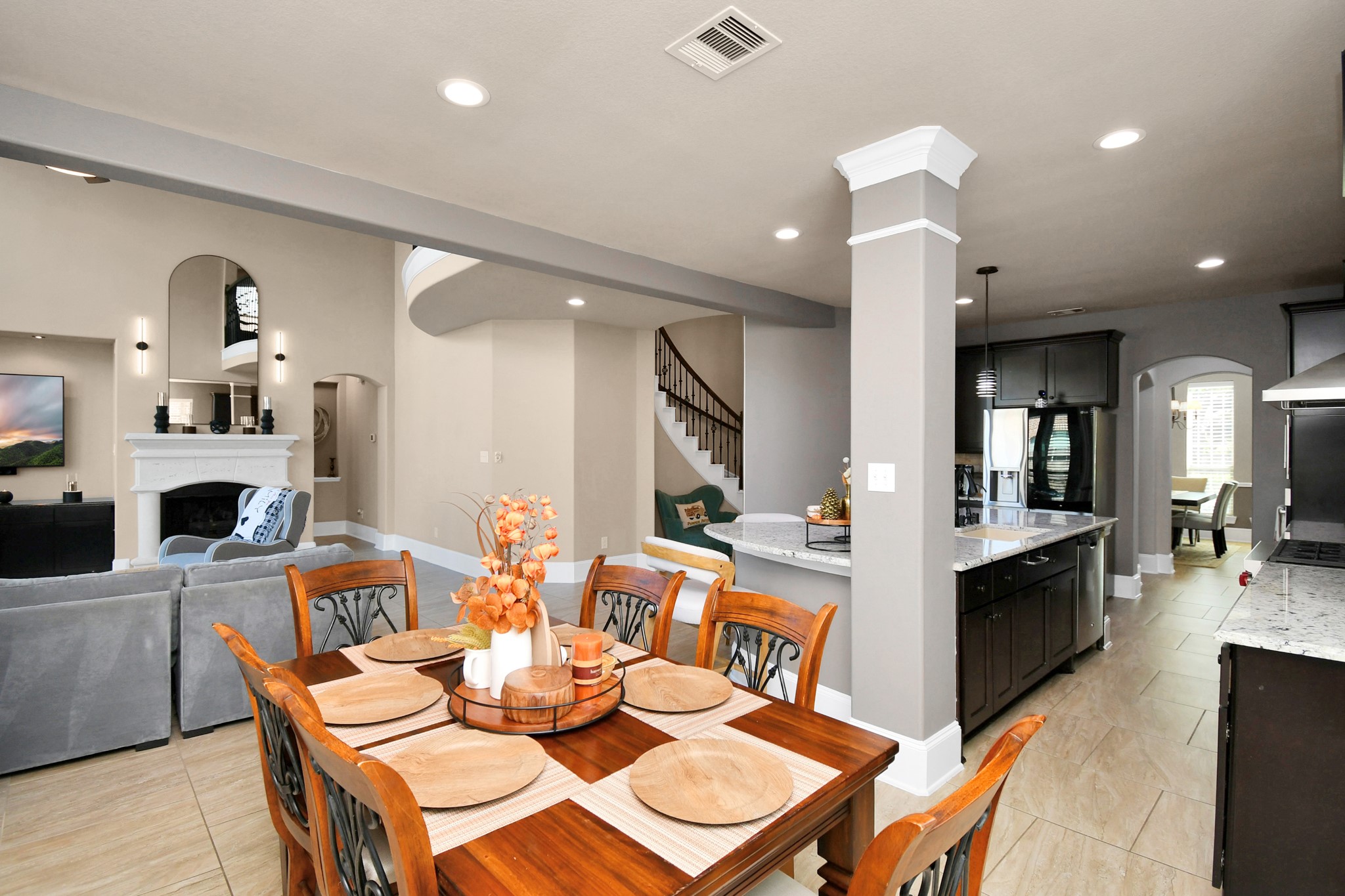 27118 Cardiff Rocks Drive Katy, TX 77494 - Photo 21 of 50 a living room with fireplace furniture and a wooden floor