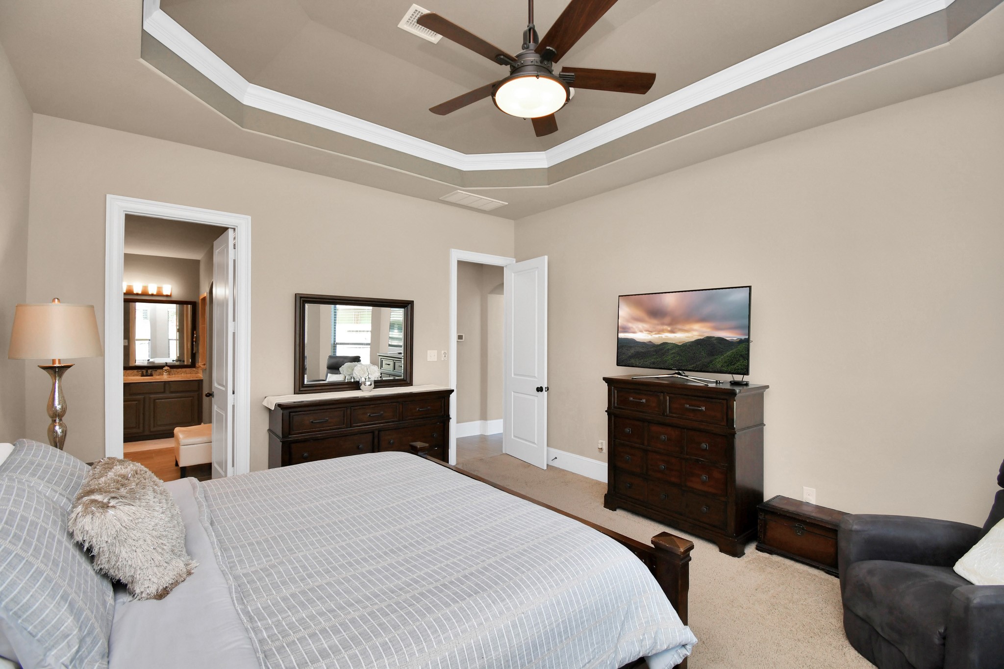 27118 Cardiff Rocks Drive Katy, TX 77494 - Photo 26 of 50 a bedroom with a bed and dresser