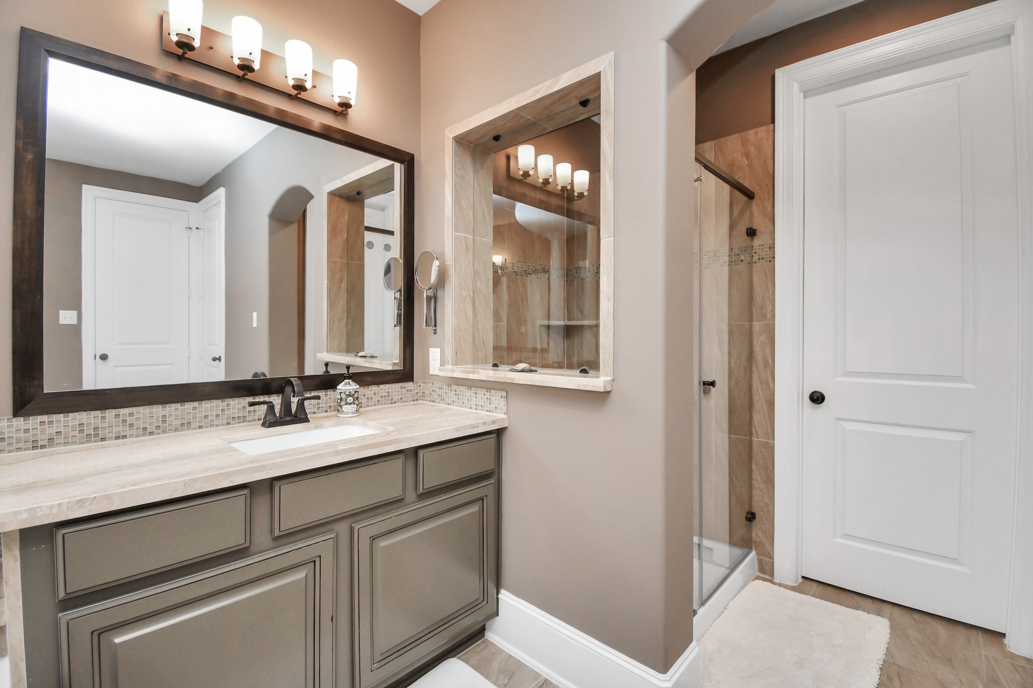 27118 Cardiff Rocks Drive Katy, TX 77494 - Photo 28 of 50 a bathroom with a sink and a mirror