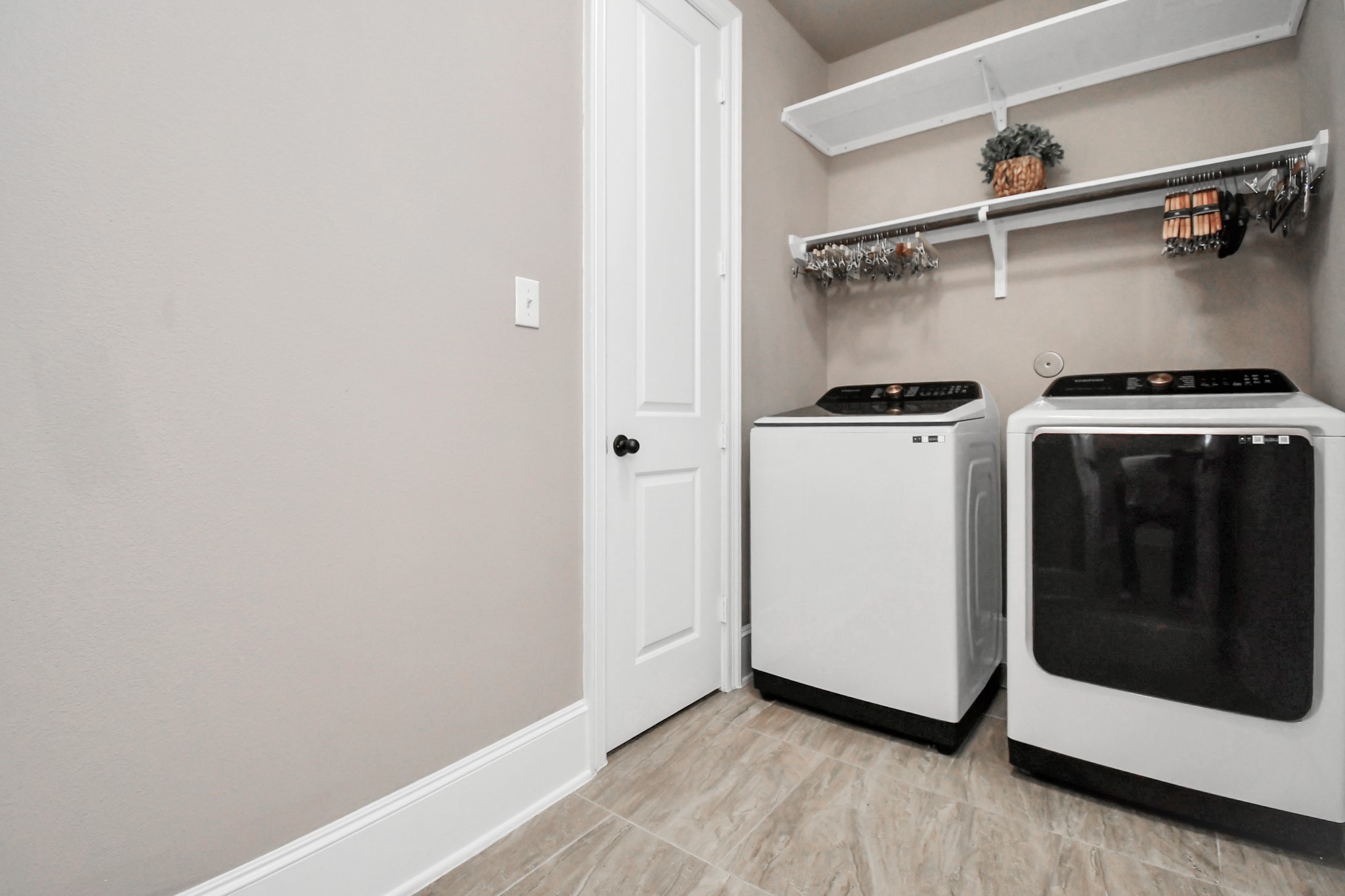 27118 Cardiff Rocks Drive Katy, TX 77494 - Photo 32 of 50 a view of a utility room with washer and dryer