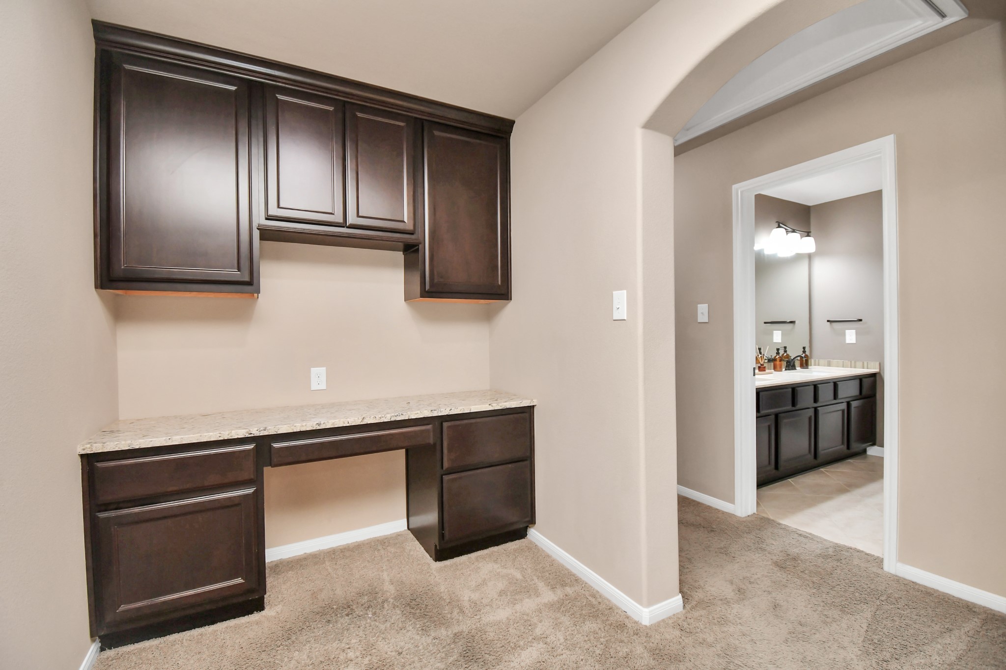 27118 Cardiff Rocks Drive Katy, TX 77494 - Photo 38 of 50 a kitchen with stainless steel appliances granite countertop a refrigerator and a sink