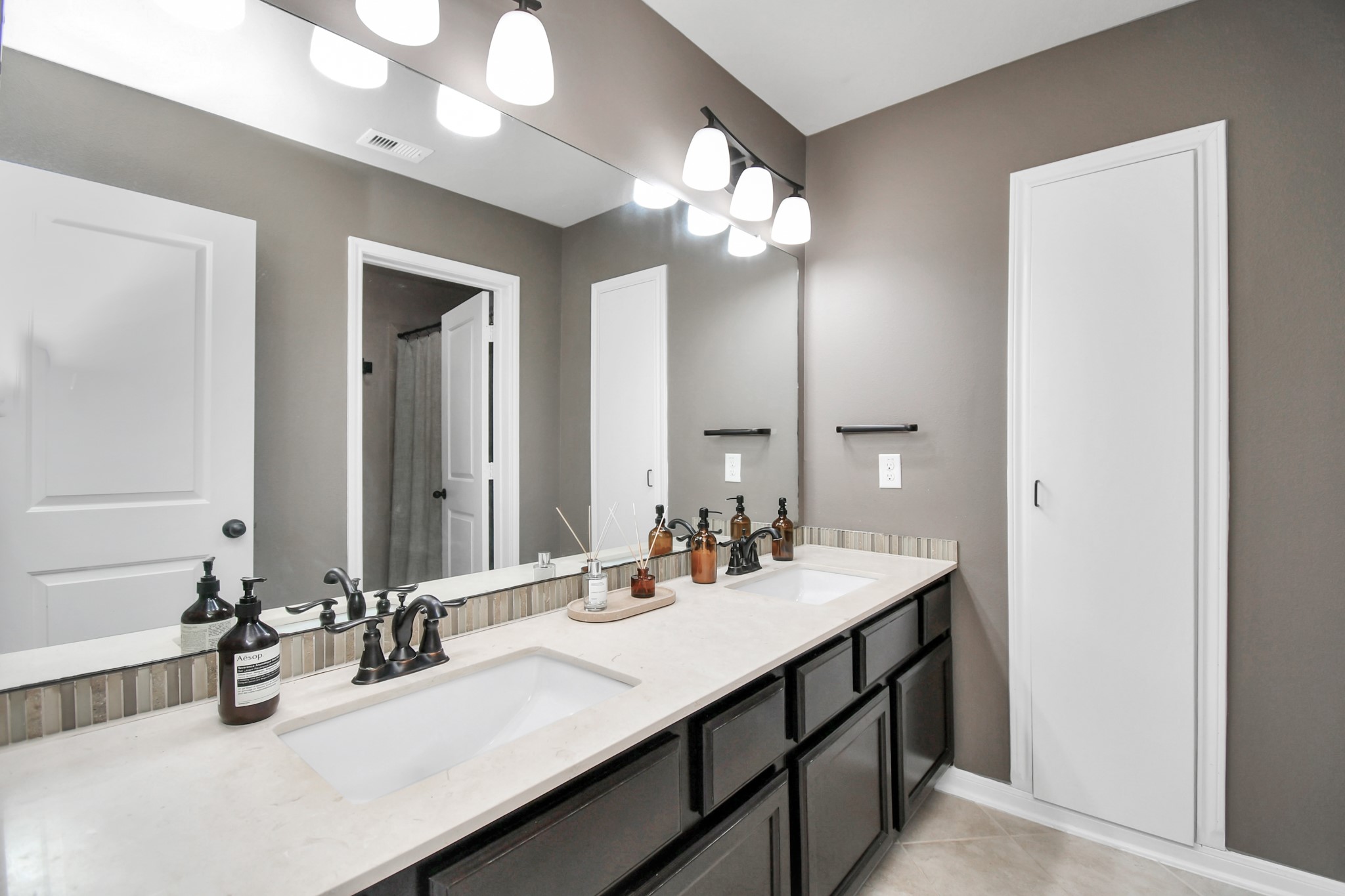 27118 Cardiff Rocks Drive Katy, TX 77494 - Photo 39 of 50 a bathroom with a sink double vanity and a mirror
