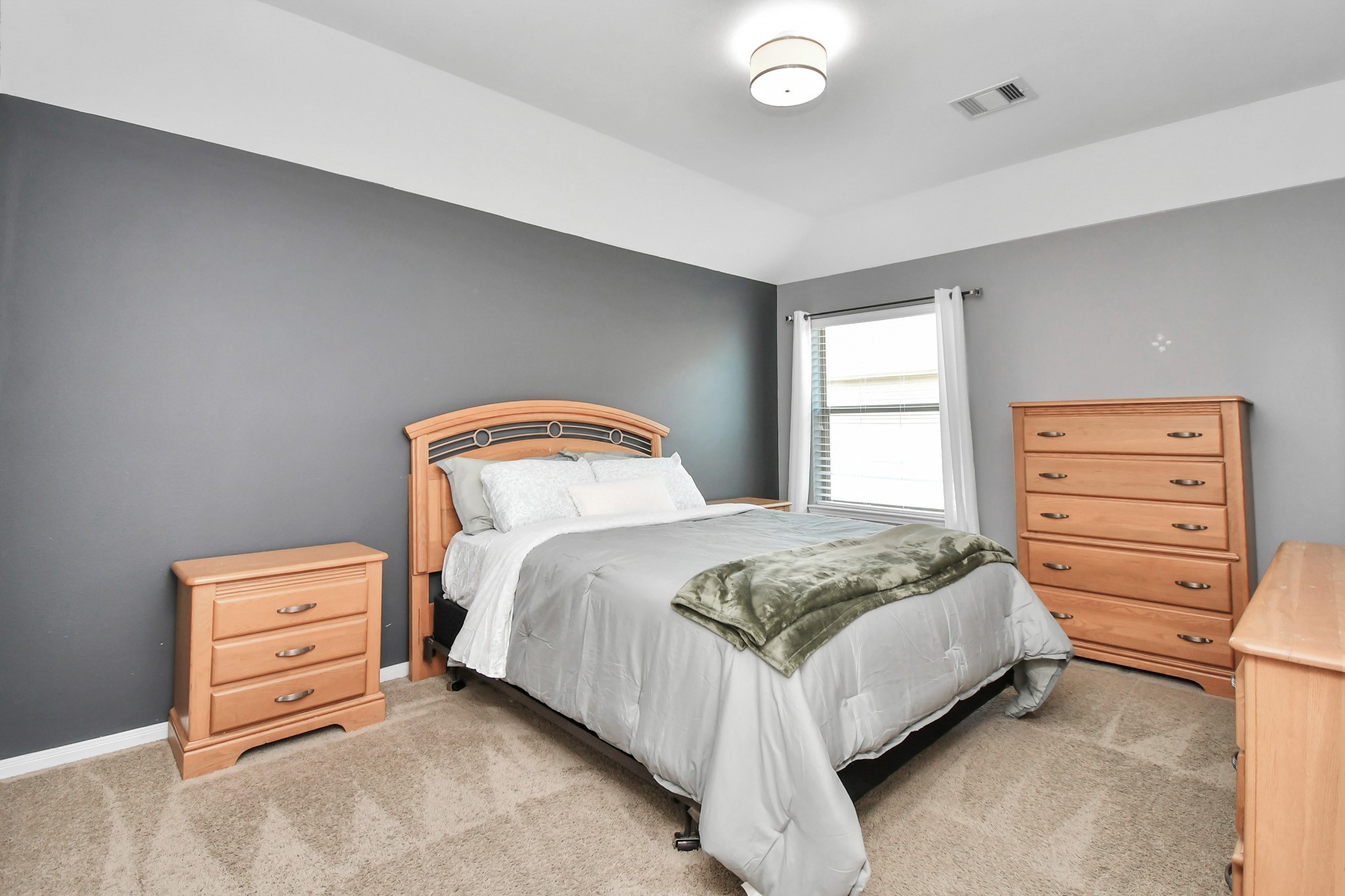 27118 Cardiff Rocks Drive Katy, TX 77494 - Photo 43 of 50 a bedroom with a bed and a dresser