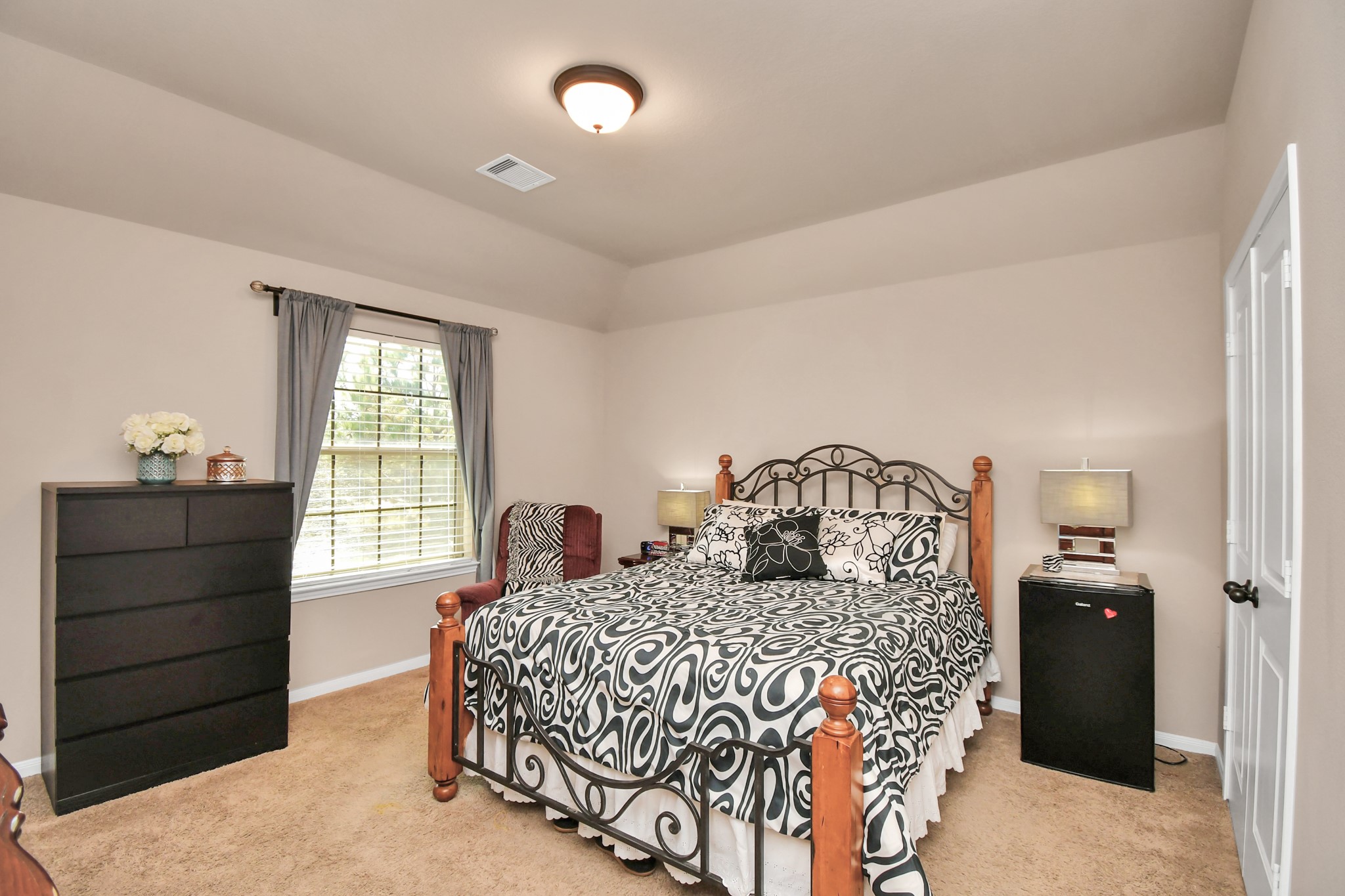 27118 Cardiff Rocks Drive Katy, TX 77494 - Photo 44 of 50 a bedroom with a bed and a dresser