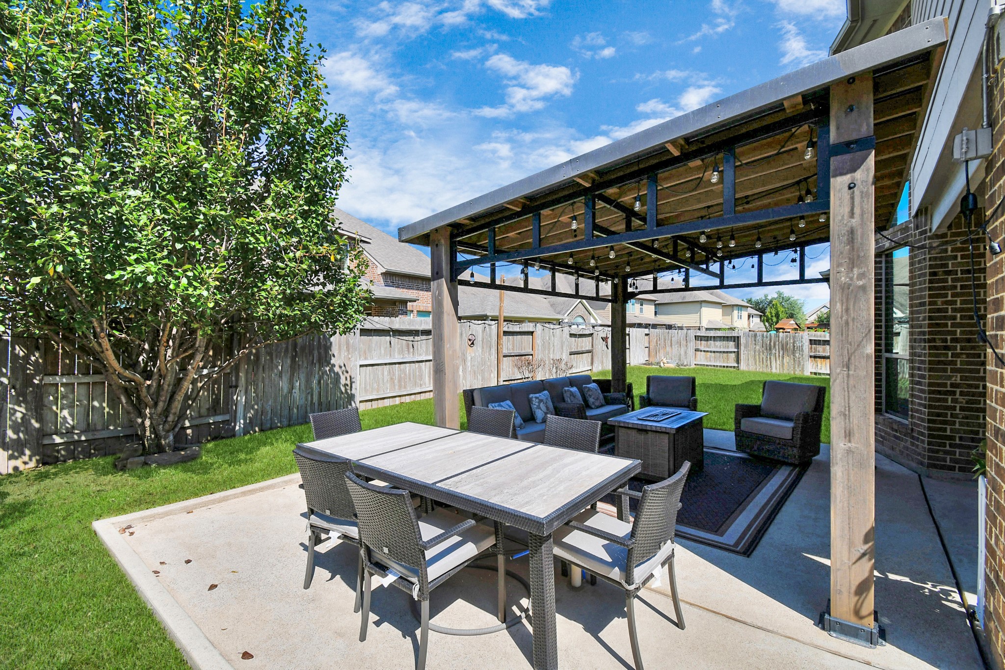 27118 Cardiff Rocks Drive Katy, TX 77494 - Photo 45 of 50 a view of a patio with a table and chairs under an umbrella