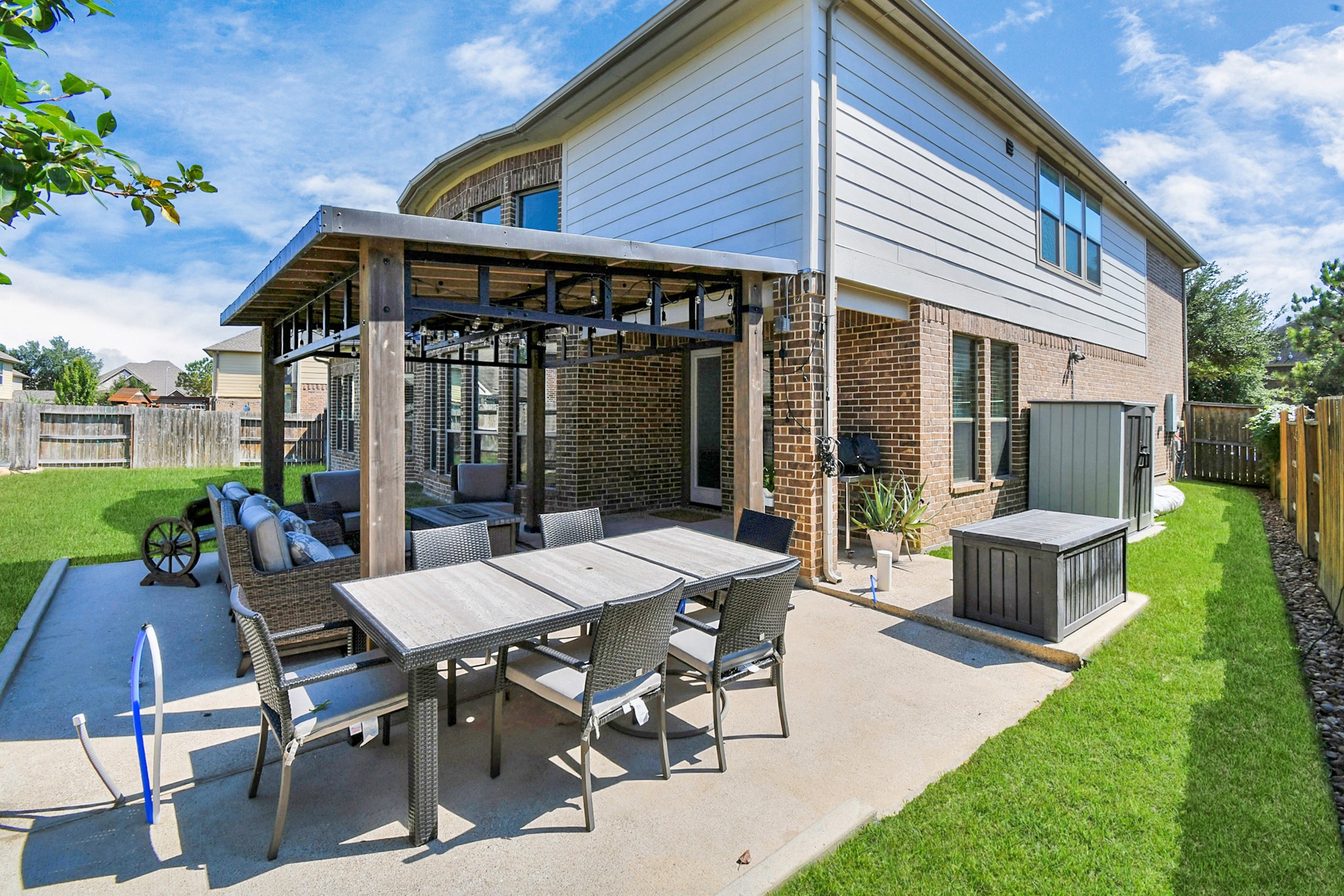 27118 Cardiff Rocks Drive Katy, TX 77494 - Photo 46 of 50 a view of a patio with table and chairs potted plants and a large tree