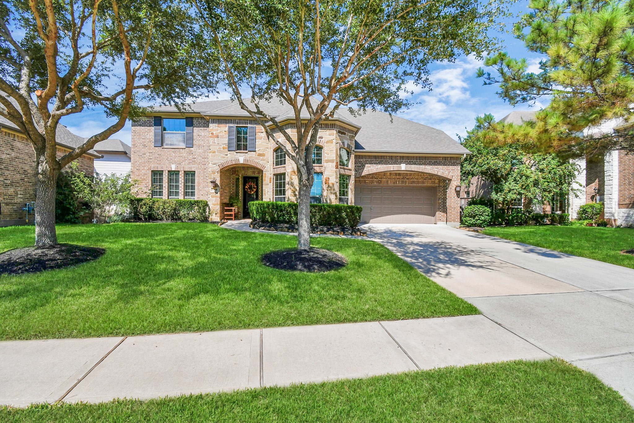 27118 Cardiff Rocks Drive Katy, TX 77494 - Photo 9 of 50 a front view of a house with a garden