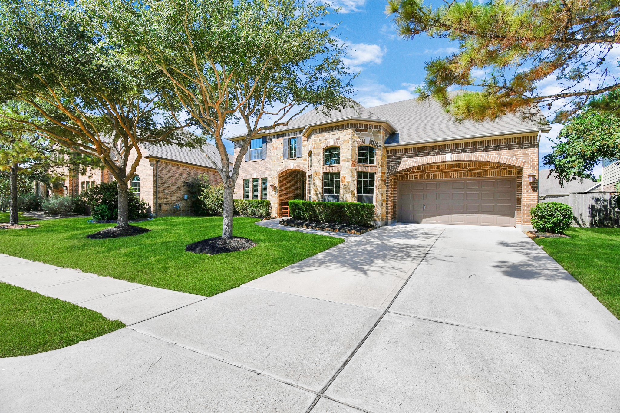 27118 Cardiff Rocks Drive Katy, TX 77494 - Photo 10 of 50 a front view of a house with a garden