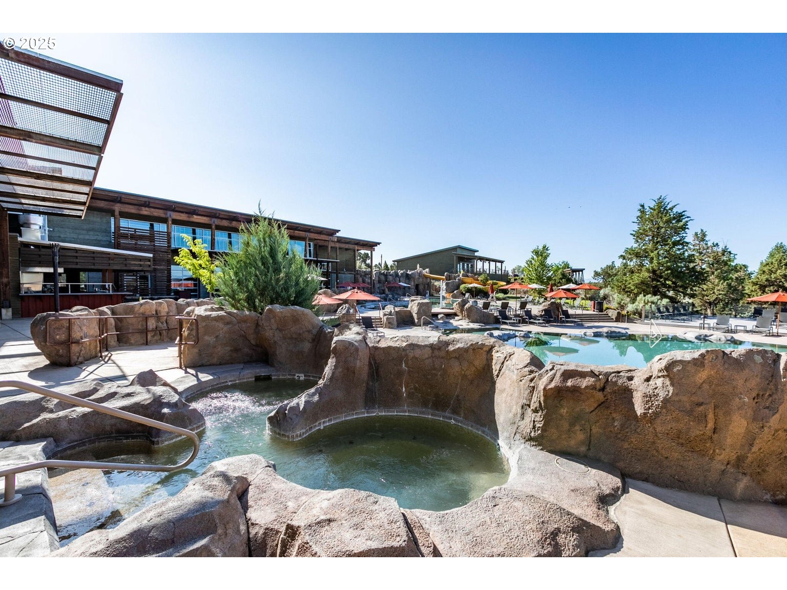 0 Southwest Brasada Rnch Road, Unit 649 Powell Butte, OR 97753 - Photo 12 of 32 a view of swimming pool with outdoor seating and plants