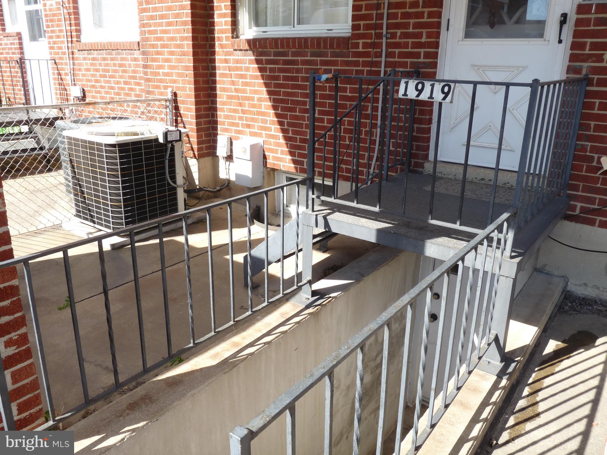 1919 Haselmere Road Baltimore, MD 21222 - Photo 22 of 23 a view of balcony with wooden floor and fence