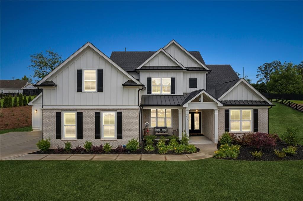 8885 Little Mill Road Cumming, GA 30041 - Photo 1 of 1 front view of a house with a yard