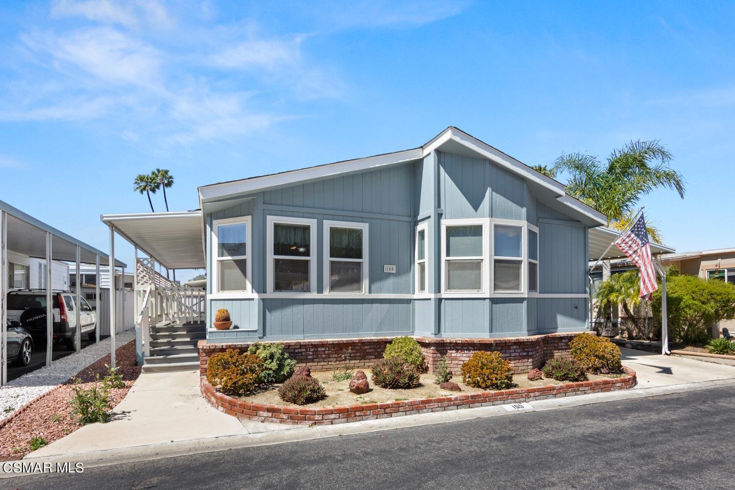 195 Tierra Rejada Road, Unit 155 Simi Valley, CA 93065 - Photo 1 of 33 a view of a house with a yard and sitting area