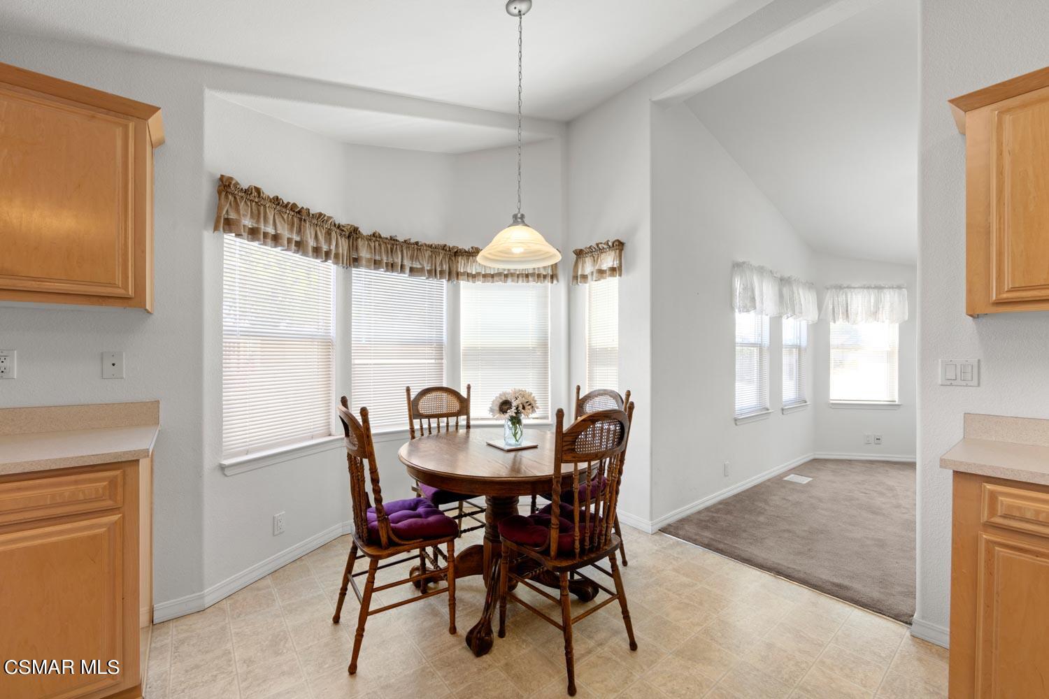 195 Tierra Rejada Road, Unit 155 Simi Valley, CA 93065 - Photo 15 of 33 a dining room with furniture and window