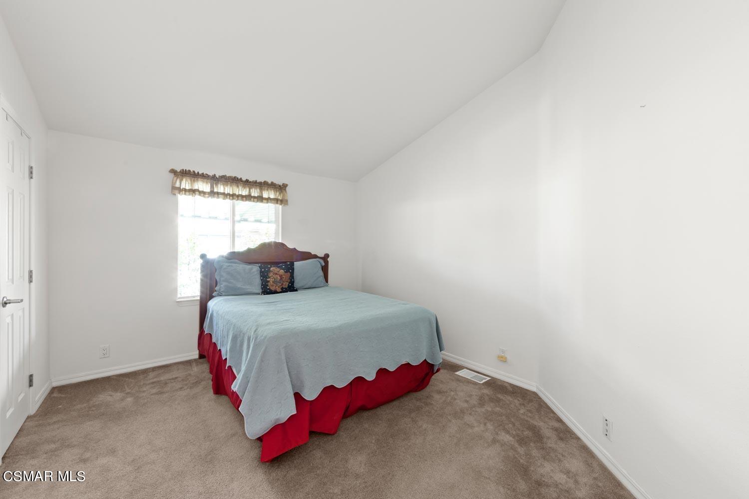 195 Tierra Rejada Road, Unit 155 Simi Valley, CA 93065 - Photo 19 of 33 a bedroom with a bed and a window