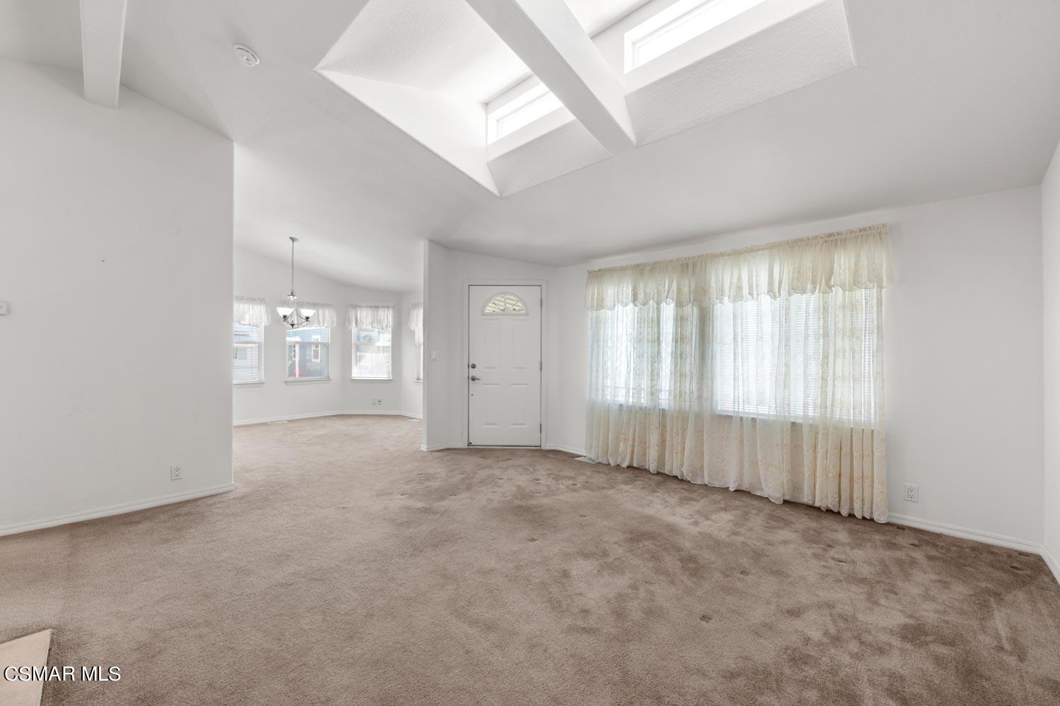 195 Tierra Rejada Road, Unit 155 Simi Valley, CA 93065 - Photo 9 of 33 an empty room with windows