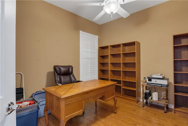 a view of a workspace with furniture and a workspace