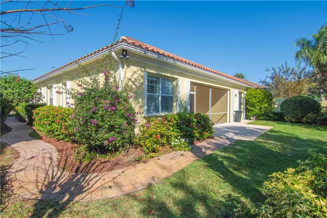 a front view of house with garden