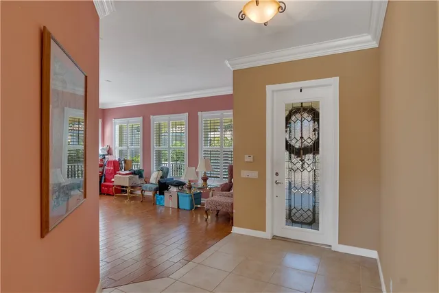 a lobby with furniture and floor to ceiling window
