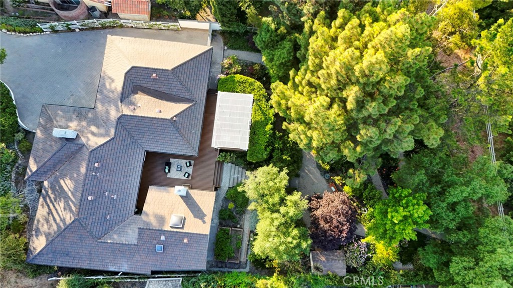 an aerial view of a house with swimming pool and outdoor space