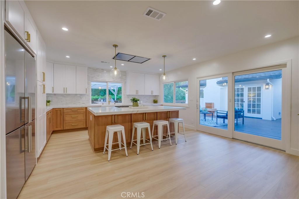 5205 Middlecrest Road Rancho Palos Verdes, CA 90275 - Photo 11 of 63 a large kitchen with a table and chairs
