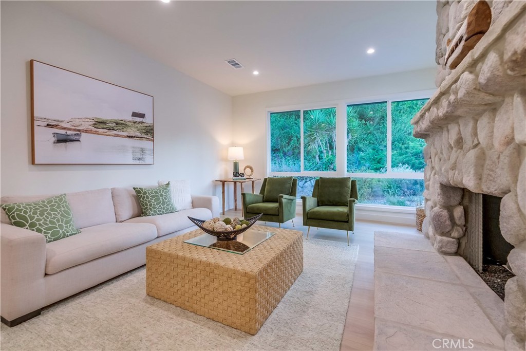 5205 Middlecrest Road Rancho Palos Verdes, CA 90275 - Photo 18 of 63 a living room with furniture and a fireplace