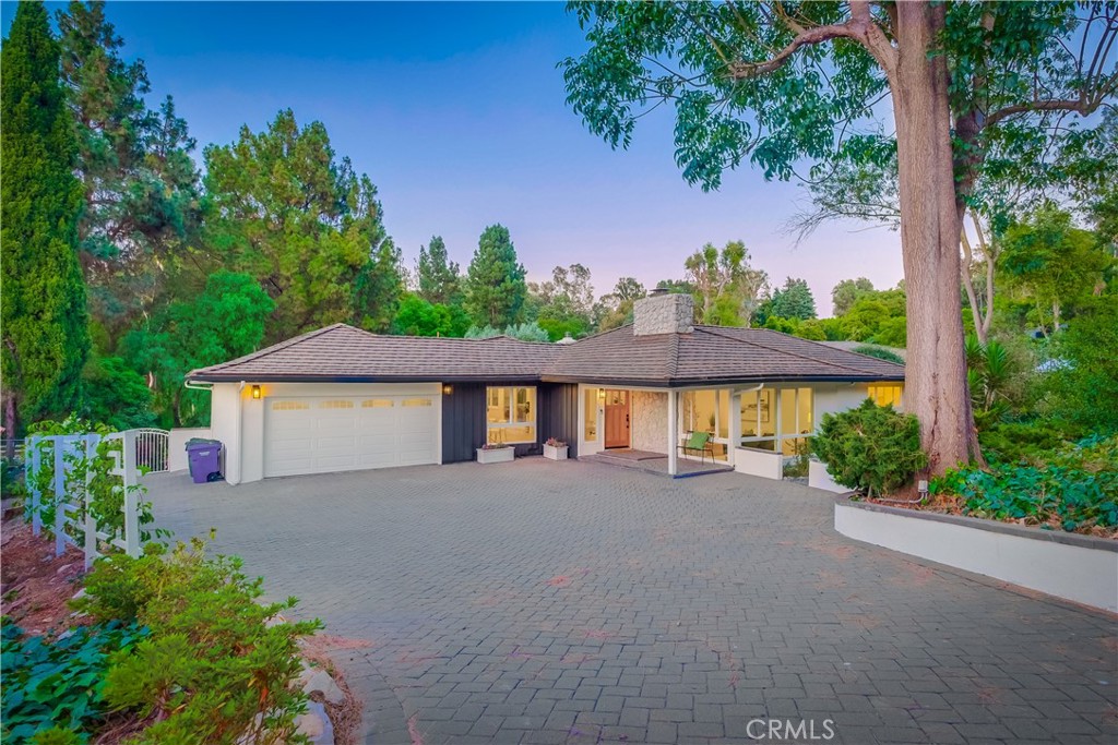 5205 Middlecrest Road Rancho Palos Verdes, CA 90275 - Photo 2 of 63 a front view of a house with a yard and a garage