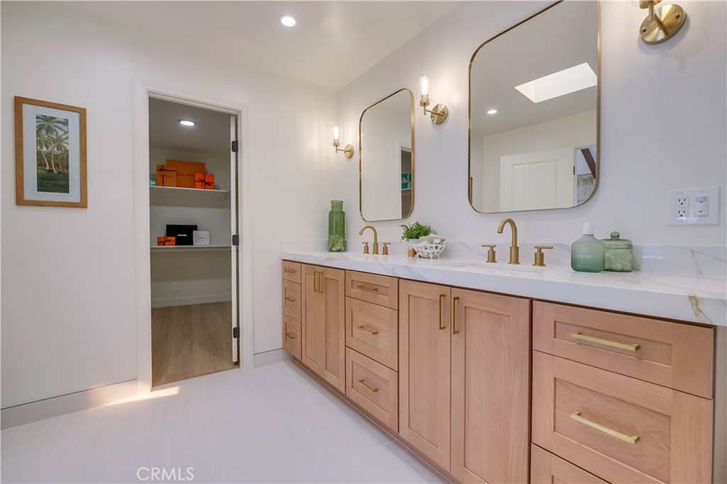 5205 Middlecrest Road Rancho Palos Verdes, CA 90275 - Photo 24 of 63 a spacious bathroom with a double vanity sink and a mirror