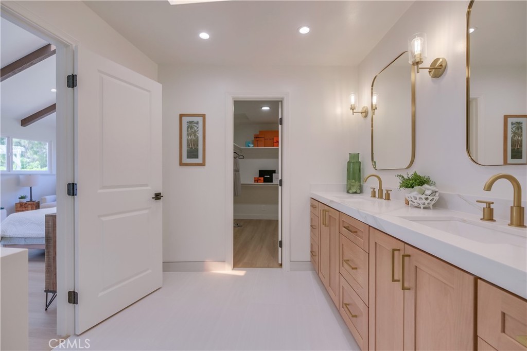 5205 Middlecrest Road Rancho Palos Verdes, CA 90275 - Photo 25 of 63 a spacious bathroom with a double vanity sink and a mirror