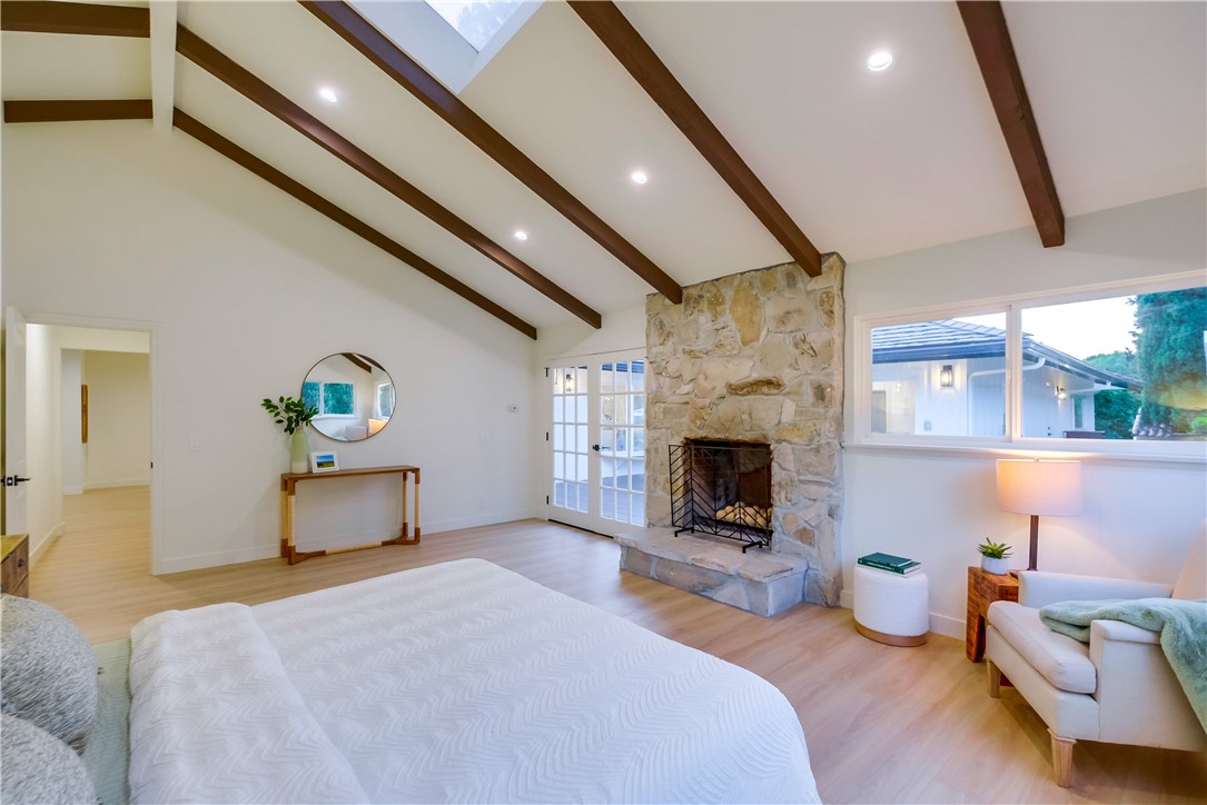 5205 Middlecrest Road Rancho Palos Verdes, CA 90275 - Photo 39 of 63 a bedroom with furniture and a fireplace