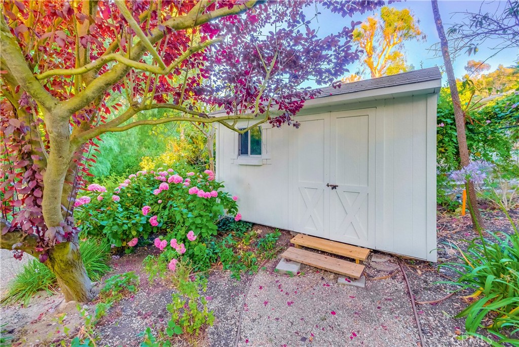 5205 Middlecrest Road Rancho Palos Verdes, CA 90275 - Photo 50 of 63 a front view of a house with a flower garden