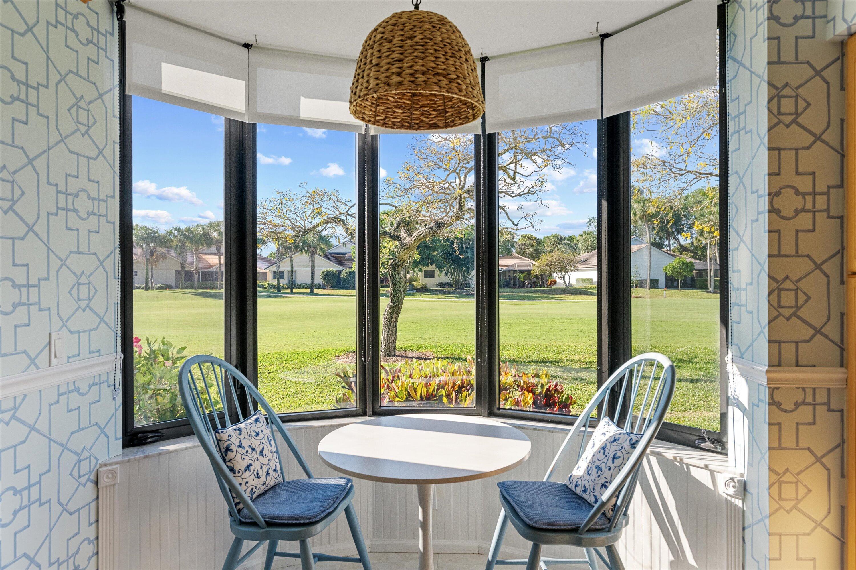 17166 Waterbend Drive, Unit 111 Jupiter, FL 33477 - Photo 15 of 34 a view of a dining room with furniture window and outside view