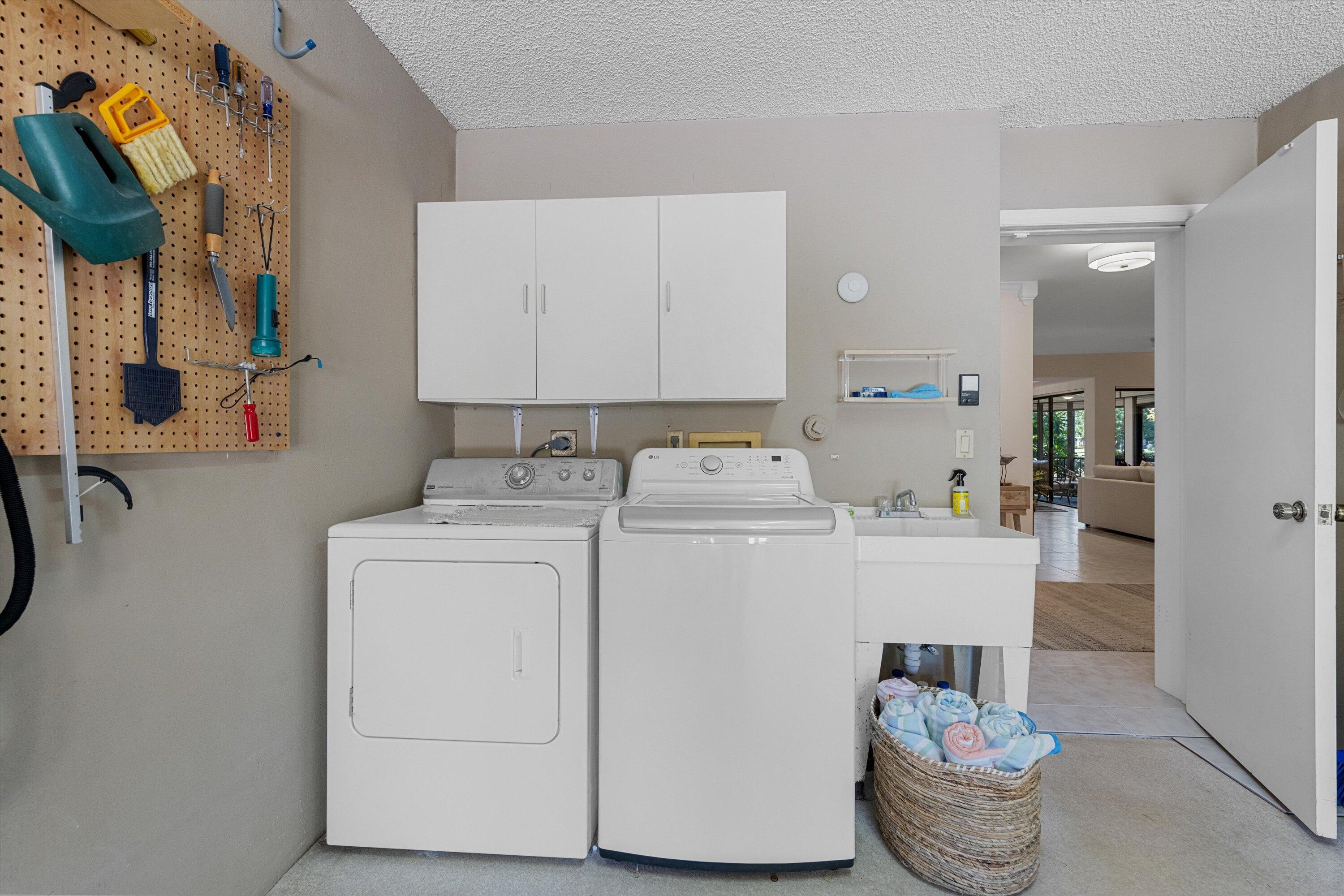 17166 Waterbend Drive, Unit 111 Jupiter, FL 33477 - Photo 28 of 34 a utility room with dryer and washer