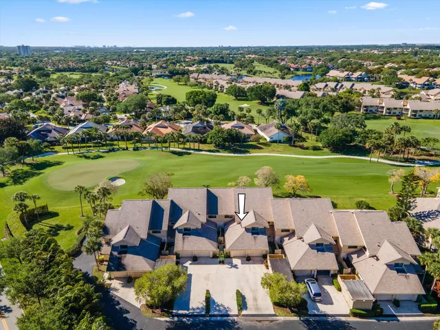 an aerial view of a house with outdoor space