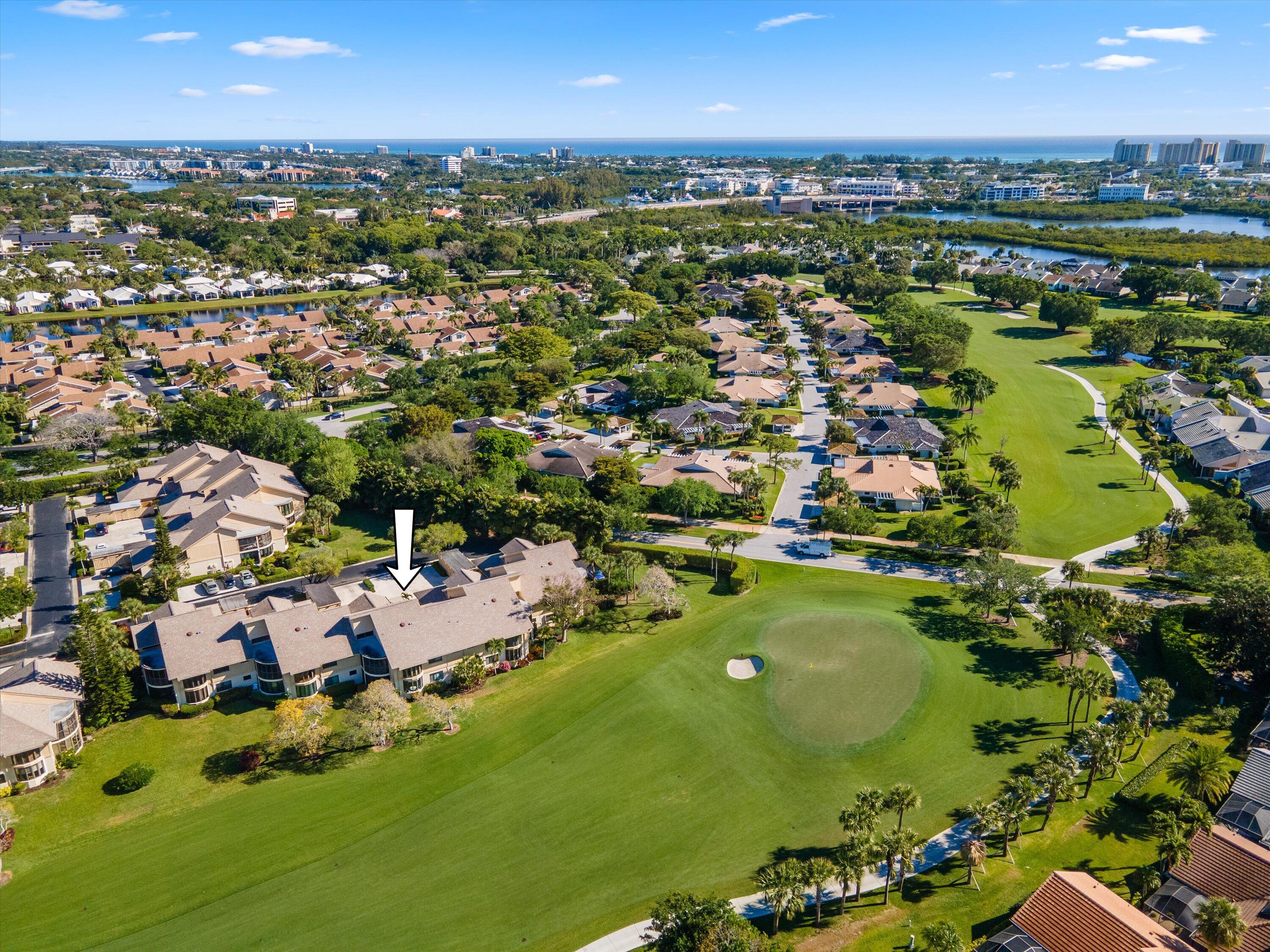 17166 Waterbend Drive, Unit 111 Jupiter, FL 33477 - Photo 33 of 34 an aerial view of residential houses with outdoor space