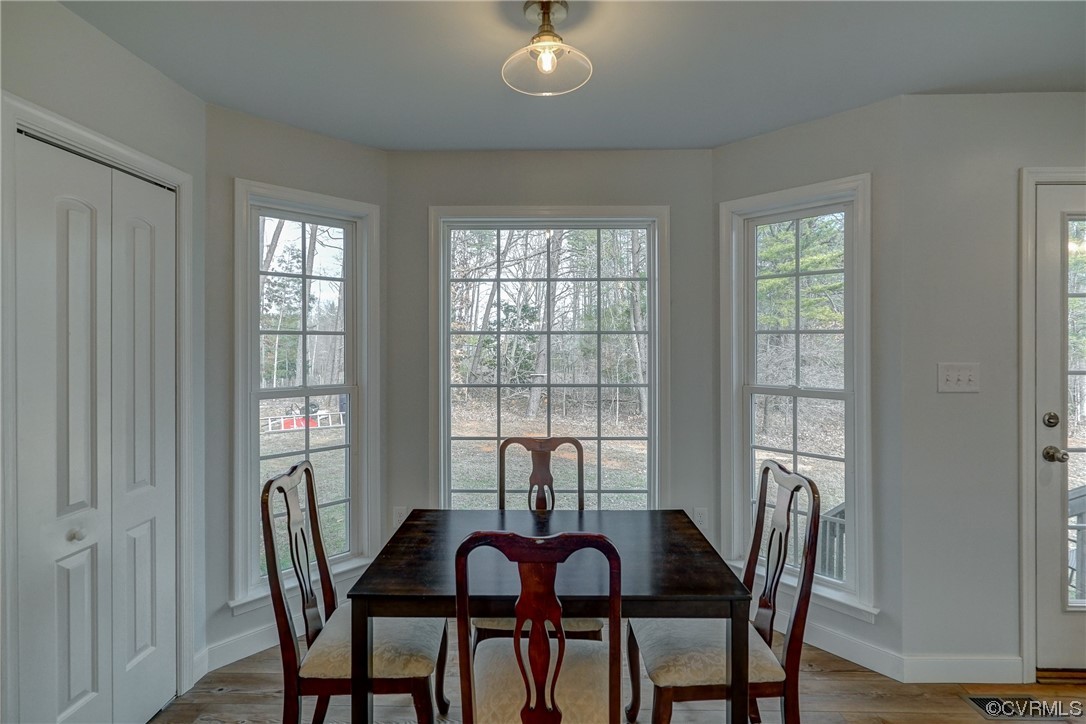 3334 Three Chopt Road Gum Spring, VA 23065 - Photo 11 of 44 a view of a dining room with furniture and window