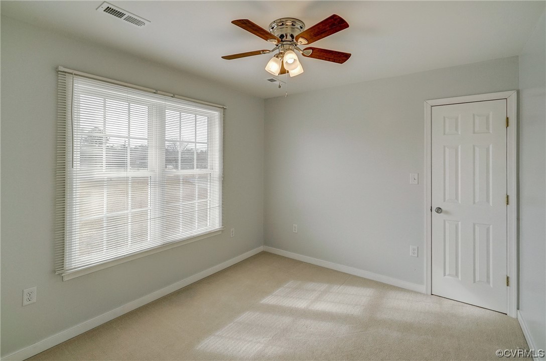 3334 Three Chopt Road Gum Spring, VA 23065 - Photo 21 of 44 an empty room with a window and a fan